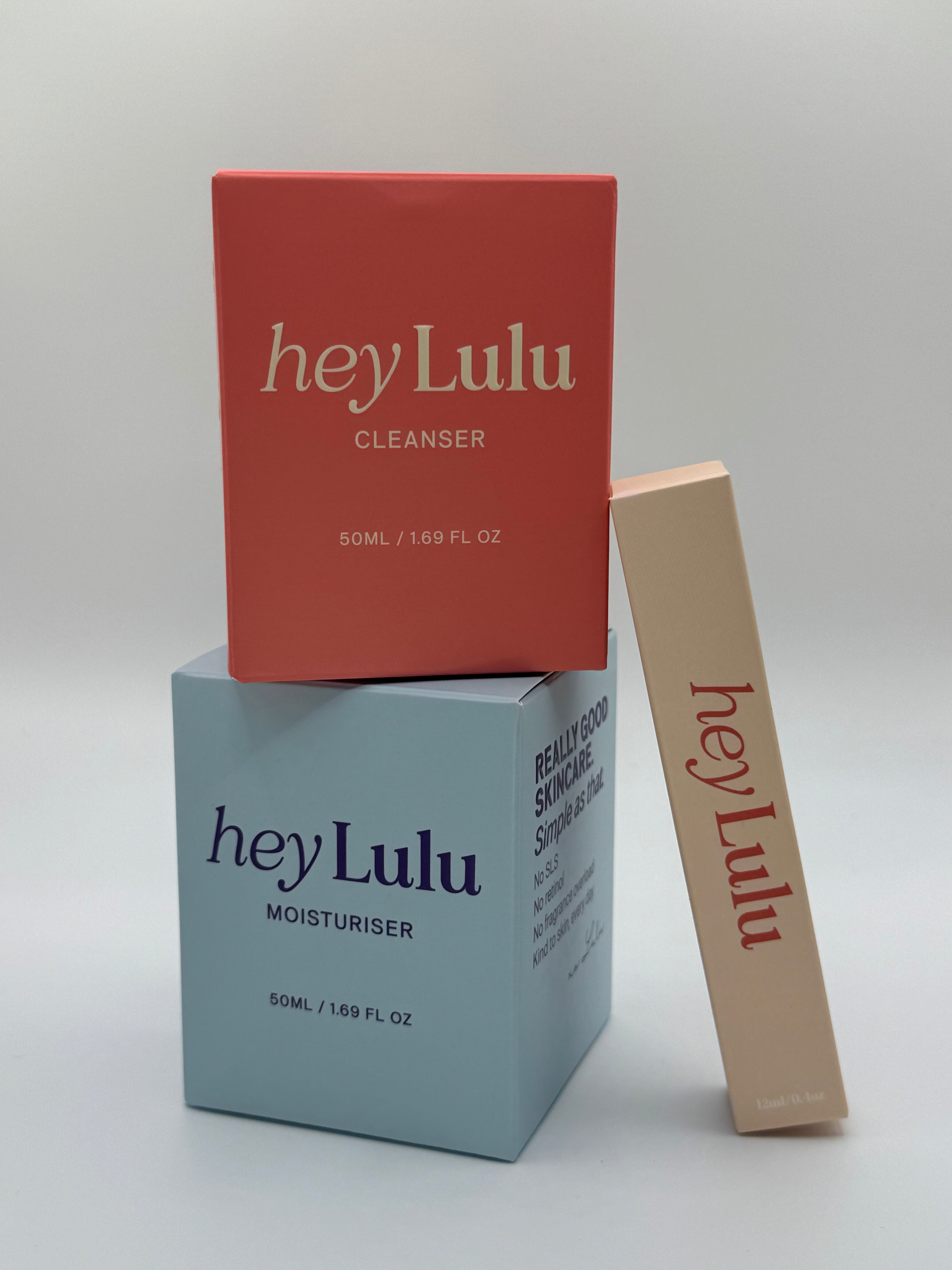 hey Lulu tween skincare essentials bundle with gentle cleanser, moisturiser and lip balm packaging styled together on a white background