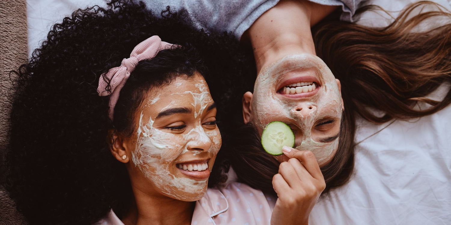 Tween girls with skincare on their face smiling with safe and age appropriate skincare routine