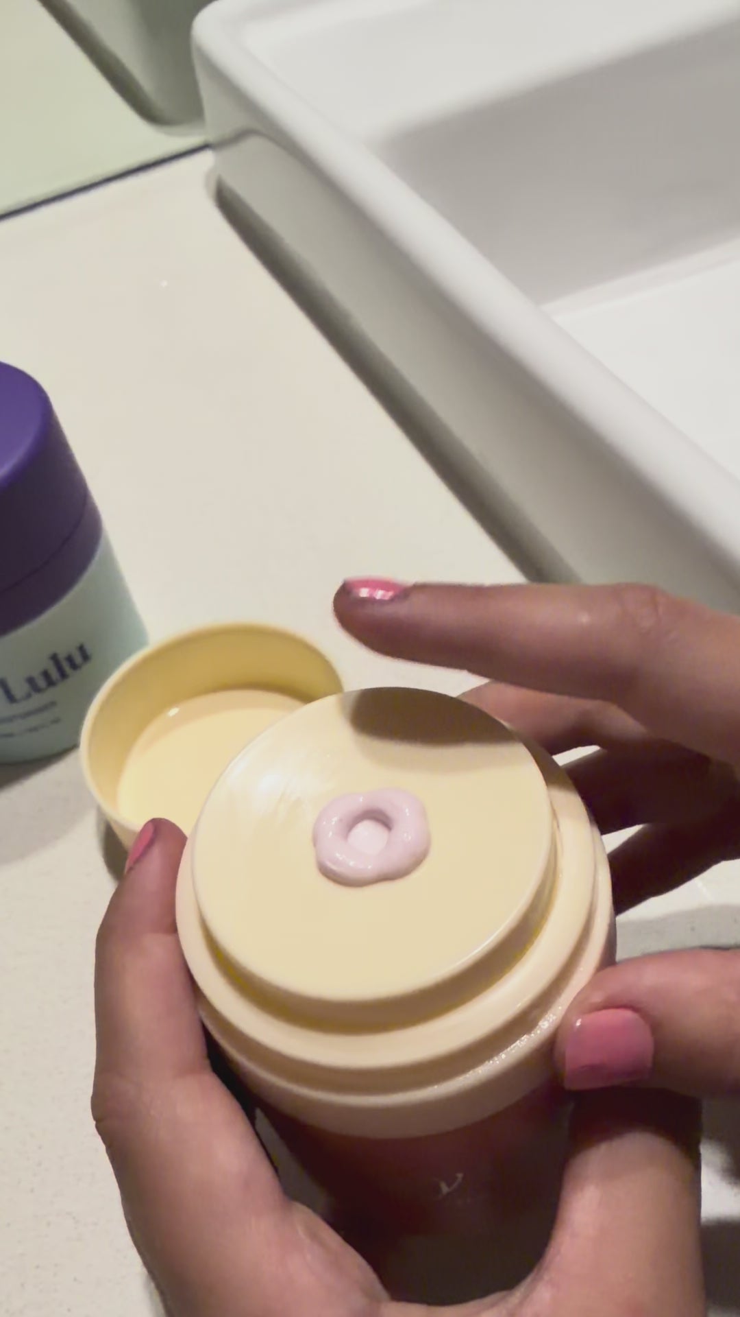 Tween girl applying Hey Lulu moisturiser as part of her age appropriate daily skincare routine